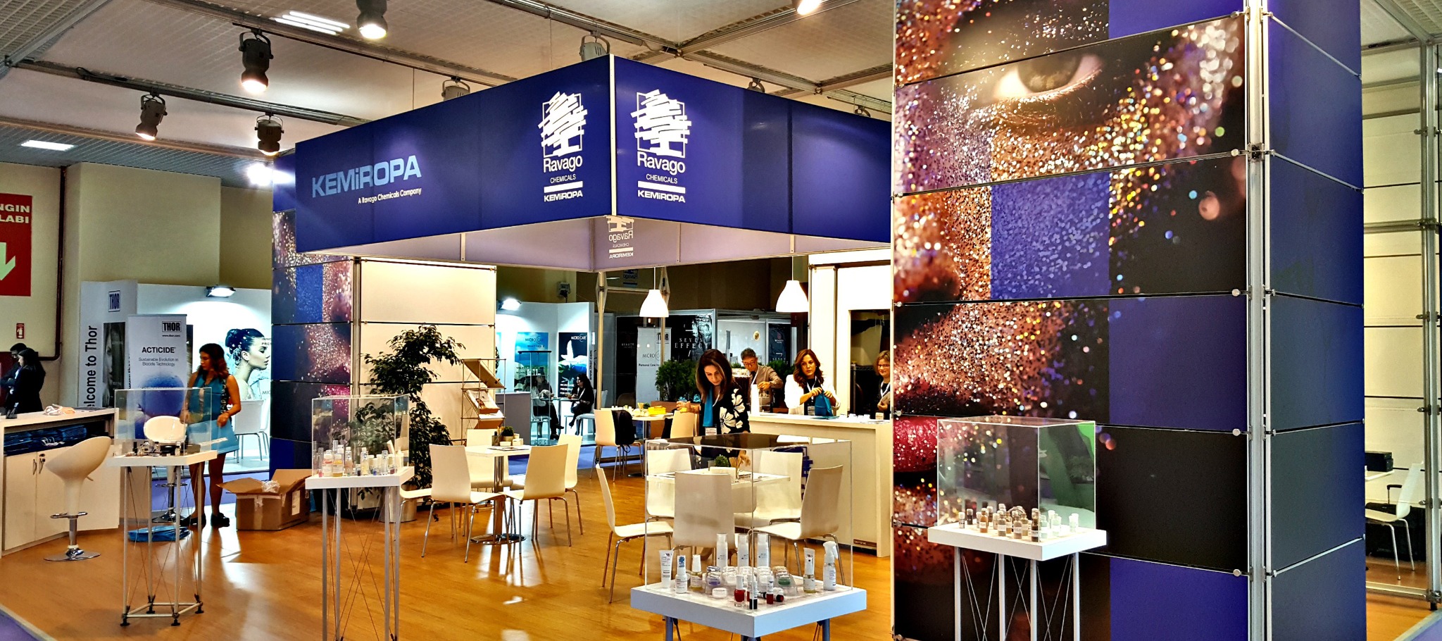 Ravago and Kemiropa exhibition stand with blue signage and product display areas